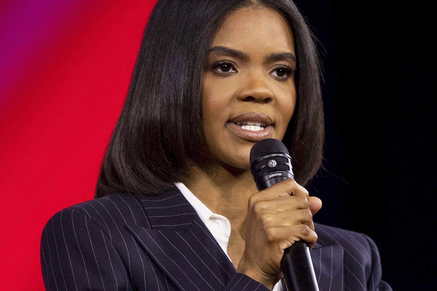 Candace Owens Farmer, close portrait at the microphone